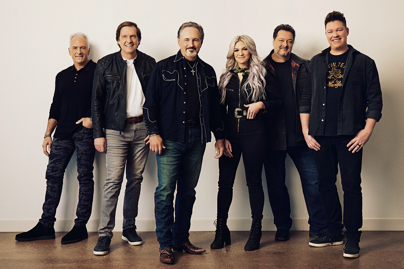 Promotional photo of the country music band Diamond Rio, with seven members standing side by side